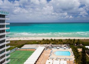 View of the pool and ocean from Seacoast Suites Apartment